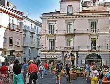 Image of holiday makers and central shops