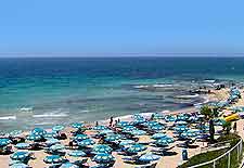 Picture of holiday makers soaking up the sunshine on the beach