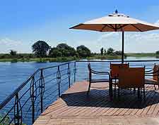 Waterfront photo showing dining table at Chobe Lodge