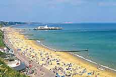 Image of a traditional summer holiday scene from the cliffs of Bournemouth, Dorset, England, UK