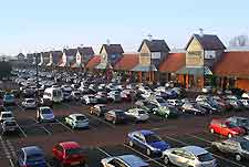 Photo showing large car park next to shopping centre