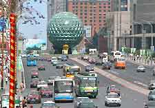 Photo of central street, with Friendship Square in the background