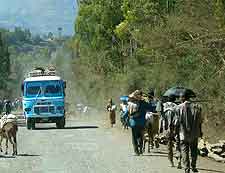 Photo of local bus and dusty road