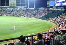 Picture of crowds watching a game of baseball at the city's Municipal Baseball Stadium