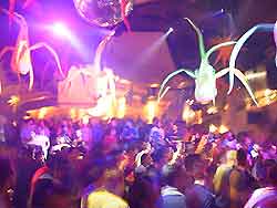 Photo showing tourists partying at a nightclub on the island of Ibiza, Spain