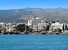 Photo of Kos Town waterfront, showing hotels and surrounding hills