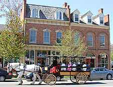Photo showing tourists enjoying a horse and carriage ride