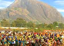 Photo of Abuja carnival celebrations, with Aso Rock in the background
