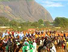 Photo of Abuja Carnival celebrations, showing Aso Rock in the background