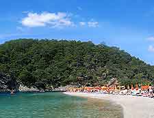 Further beachfront image, showing the hilly backdrop