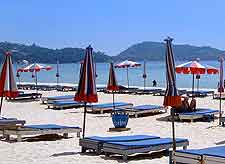 Photo of sun loungers on the beachfront