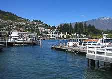 Bay photograph, showing boats and distant mountains