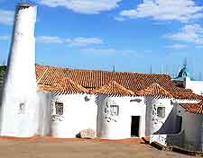 Photograph showing the historic white-washed Stella Maris Church attraction in the port town of Porto Cervo