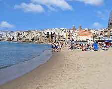 Further photo of sunbathers on Cefalu Beach