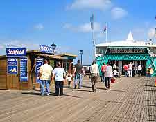 View of summer holiday makers strolling on Paignton Pier